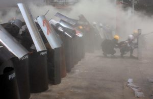 Myanmar forces fire tear gas, stun grenades on protest as UN envoy calls for action